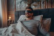 © VolumeThings - Man smiling wearing a sleeping mask ready to sleep
