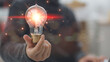 © CL STOCK - Hand-holding illuminated light bulb, concept creativity with bulbs that shine glitter. Inspiration of ideas for sustainable business development. Idea innovation and inspiration concept.