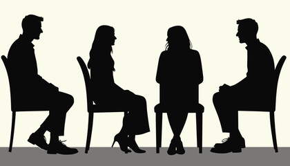 Silhouettes of two men and two women sitting on chairs in a focused discussion.