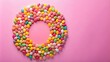© prasit - Oval egg shape candies on pink background flat lay panoramic