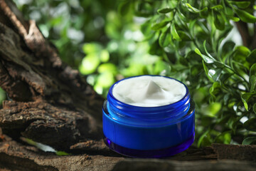 Poster - Stylish presentation of facial cream in jar outdoors, closeup