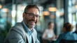© Postproduction - Confident middle-aged businessman engaging with clients. Professional and interpersonal skills concept. Business and leadership idea.
