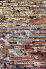 Wall Mural - Section of an old wall of red bricks