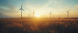 © The Stock Photo Girl - Windmills producing electricity in the field at sunset, renewable energy concept
