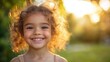 © Benjawan - Beautiful portrait of a smiling child in a park, soft natural light and blurred background, taken with a mobile phone, capturing the moment perfectly, copy space for stock photo with minimal concept,