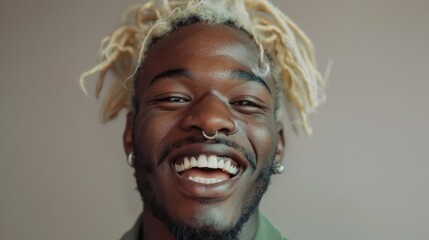 Poster - A man with a nose ring and dreadlocks is smiling