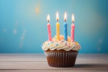 Naklejka na meble Birthday Cupcake with Four Candles on a Wooden Table