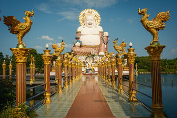 Wat Plai Laem Temple buddhist in Koh Samui Island Thailand tilt up of big buddha sculpture landmark