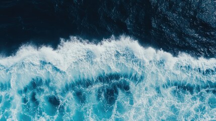 aerial top view background photo of ocean sea water white wave splashing in the deep sea