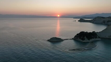 Wall Mural - Beautiful  sunrise view of Cape Drastis in the island of Corfu in Greece. Cape Drastis, the impressive formations of the ground, rocks and the blue waters panorama, Corfu, Greece, Ionian Islands.