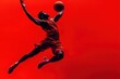 © stock.metket.com - A dynamic and powerful shot of a basketball player in mid-air poised to make a layup