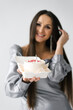 © Sunshine - Birthday smiling woman is holding a cake in a plastic container