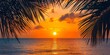 © Thanthara - A nostalgic photograph of a tropical sunset, framed by the silhouette of palm leaves. The setting sun casts a warm, orange glow across the sky and the calm ocean water