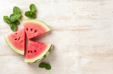 Sticker - Watermelon Slices on a Wooden Background