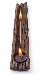 Wall Mural - Burning Match and Candle on a Wooden Log.