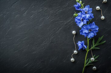 Sticker - Blue Flower with Pearls on a Black Slate Background