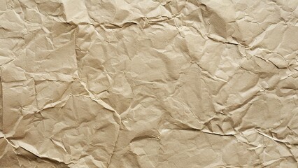 Wall Mural - A close-up shot of a crumpled brown paper texture. The paper is wrinkled and has a natural, organic look.