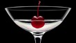© Kartik - Maraschino cherry dropped in cocktail glass with fluid isolated on black