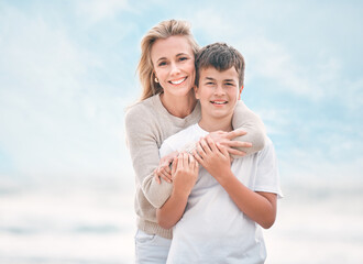 Poster - Portrait, support and mother with son on beach together for holiday, travel or vacation. Hug, love or smile with single parent woman and boy child embracing outdoor for bonding or wellness in summer