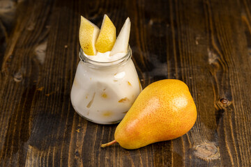 pear yogurt with pieces of fruit on the table