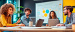 © Who is Danny - Team collaborating in a modern office, discussing ideas around a table with laptops and charts on a bright background.