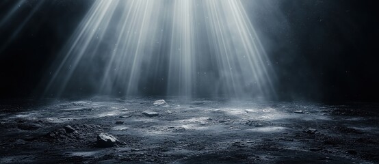 Black background with white light rays shining down on the ground, creating an abstract and atmospheric scene