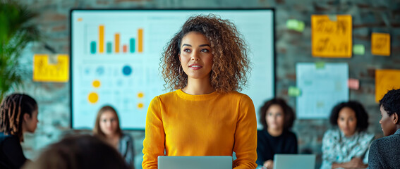 Canvas Print - Woman leading a business presentation in a modern office.