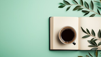 Wall Mural - A cup of coffee sits on top of an open book