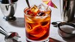 © Kartik - Glass of tasty Long Island iced tea, ice cubes and bartender tools on light background