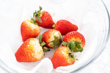 Poster - Washed and Dried Strawberries Neatly Stored in a Glass Bowl