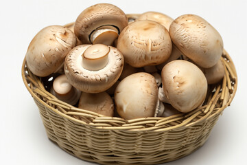 Basket of mushrooms in white on a . mushroom food fresh concept. a white basket with mushrooms, champignons, and other vegetables on the . a basket of vegetables with mushrooms and champignons on a.