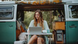 © Natalia Klenova - Digital Nomad Working Outdoors from Van