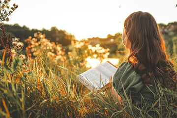 Poster - Girl with an open Bible in her hands, summer mood