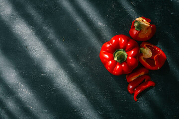 Red bell pepper on black background