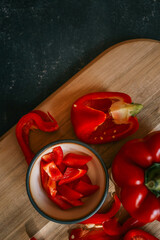 Red bell pepper on black background