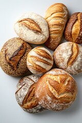 Wall Mural - Assortment of various freshly baked breads on white background