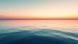 © Matcha_09 - A calm sea reflecting the colors of a vibrant sunset, with the horizon stretching endlessly into the distance.