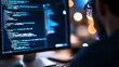 © AKE - A developer coding at night on a computer with colorful programming text displayed on the screen, creating innovative software solutions.