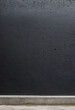 © Iveta - textured black matte concrete wall