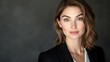© Vilaphon  - Professional headshot of a woman in a business suit with a soft focus and clean backdrop