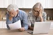 © fizkes - Stressed elderly couple read awful news from bank about debt, late payment, overspend or subpoena, experiencing financial problems, finances shortage feel desperate. Eviction notification, huge taxes