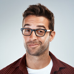 Sticker - Man, face and happy with eyeglasses in studio on white background with eyewear prescription for eyesight. Male person, smile and confident on portrait with frame for spectacles, lens and vision