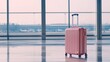 © ciaoaleandro - pink baggage travel with blur airport background waiting for departure concept