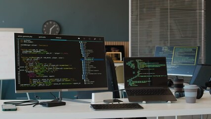 No people shot of modern leading IT company office equipped with various computers with codes on screens