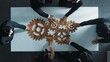 © Summit Art Creations - Top view of smart business people gather wooden cog together at meeting. Group of project manager helping and team working to solve problem at meeting room or workplace. Represent unity. Directorate.