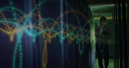 Canvas Print - Colorful waveforms and data processing animation over person walking in server room