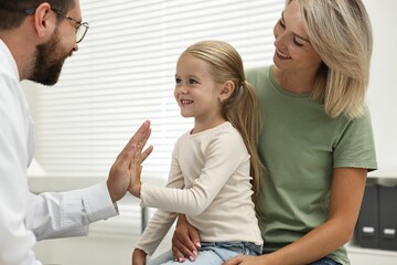 Sticker - Mother and her little daughter having appointment with doctor in hospital