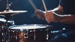 © PondLord - A close-up shot of a drummer's hands skillfully playing a snare drum with dynamic motion, showcasing the energy of live performance
