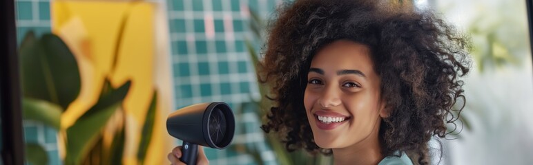 Wall Mural - A young woman with a hair dryer dries her lush curly hair