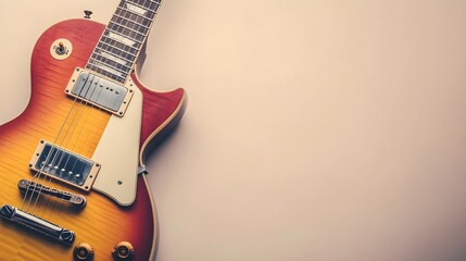 A close-up of a vintage guitar resting against a light solid color background, evoking the spirit of classic rock and roll